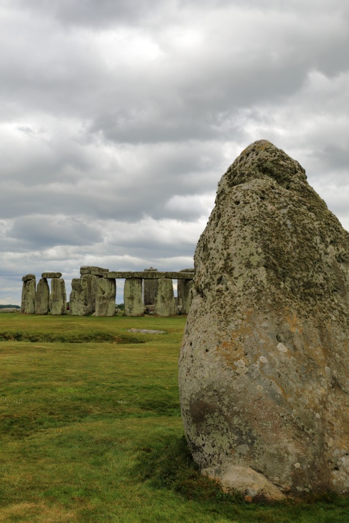 Heel stone with Stonehenge behind